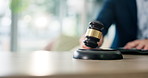 Judge, hands and person with gavel for justice, book or law with attention in government courtroom. Hammer, legal system and closeup of lawyer with punishment for crime, decision or rules enforcement
