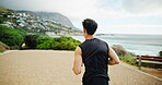 Fitness, running and back with man in nature for marathon practice, exercise and performance. Workout, wellness and cardio with person training at park for sports athlete, challenge and race