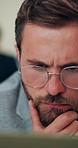 Man, journalist and thinking with computer in office, review and reading with insight, investigation and story. Person, writer and problem solving with editing, feedback or article for newsletter