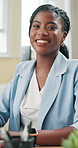 Black woman, happy and face in office for business, positive feedback and new opportunity. Laugh, glasses and administrator at computer with good news, confidence and excited for career development