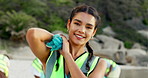 Face, ocean and woman with trash bag, volunteer and sustainability with earth day, recycle and environment. Portrait, climate change and activist with plastic collection, eco friendly and beach
