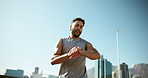Man, running and smart watch in city for fitness with timer, speed and low angle with sky, exercise and summer. Person, athlete and stopwatch with results, stats or training for marathon in Cape Town