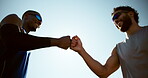 Active, men and fist bump with support in city for agreement, fitness deal and team celebration. People, partnership and motivation of sports success, achievement and respect with solidarity in urban
