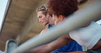 Fitness, stretching and couple of friends in city for workout preparation or body health. Warm up, athlete and getting ready to exercise outdoor, training and interracial people talk in low angle