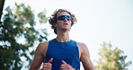 Running, fitness and man with training, wellness and energy with cardio, nature and challenge. Healthy person, outdoor or marathon with eyewear, practice for marathon or jogging with hobby or active