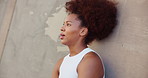 Woman, tired and outdoor with smart watch for fitness, check time and rest for workout by wall. Mockup, African female person and breathing with clock for exercise stats, health results and exhausted