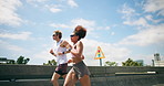 People, running and training in city for fitness, cardio challenge and workout for endurance. Urban, handheld and friends on road for practice, active and exercise for marathon or muscle development