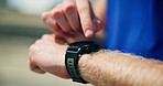 Hands, outdoor and man with fitness, smart watch and tracking progress with training. Closeup, person and runner in city, check time and exercise with monitor heart rate, step counter or workout gear