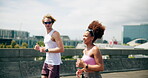 Interracial couple, training and running in city for workout, exercise or fitness together in urban town. Man, woman and athlete with cardio, sports or marathon for endurance and health or wellness
