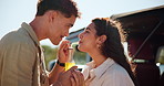 Couple, bottle and happy with drink on road trip, playful and bonding by car with memory, love and vacation. People, man and woman with soda, straw and smile with profile by vehicle in Colombia