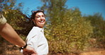 Running, holding hands and couple in desert, adventure and escape from location for love and outdoor. Travel, people and lovers with loyalty for relationship, journey and woman with smile in nature