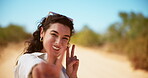Travel, face and woman with peace sign, outdoor and happy on vacation for adventure, desert and excited. Holiday, tourist and person with gesture on trip, confident and traveller with smile in nature