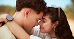 Forehead, outdoor and couple with love, travel and bonding together with happiness. People, embrace and man with woman, nature and romance with relationship, marriage and vacation with trust
