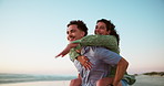 Sea, piggyback and couple on vacation, freedom and exploration in nature for romance, people or together. Outdoor, tourist and playful on date at beach, man and woman on holiday for tourism or travel