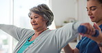 Physiotherapy, elderly woman and weights in practice for rehabilitation, mobility exercise and smile for recovery progress. Specialist, senior patient and support for wellness with muscle development