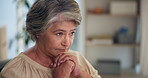 Home, thinking and old woman with anxiety, hands together and spiritual with financial pressure. Reflection, pensioner and mature person in lounge, prayer and nostalgia with memory, stress and hope