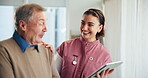 Nurse, tablet and senior man with laugh, discussion and support in consultation. Tech, healthcare and patient in conversation for rehabilitation, medical care or test results on app in nursing home