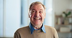 Happy, home and face of senior man for relaxing, confidence and smile in morning. Retirement, pensioner and portrait of elderly person with laugh for funny joke, humor and carefree in living room