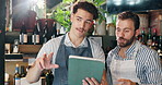 Waiter, tablet and men in cafe talking for planning, discussion and training in coffee shop. Small business, restaurant and barista with manager on digital tech for inventory, menu and online orders