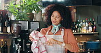 Waitress, woman and cleaning glass in restaurant for hygiene, dust removal and workflow maintenance. Hospitality industry, happy barista and wipe glassware with inspection, germs or bistro sanitation