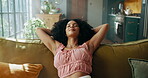 Smile, woman and relax with stretching on sofa for weekend break, breathing or peaceful satisfaction. Cozy, african person or happy with rest in living room for day off, comfortable couch or wellness