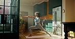 Pilates, woman or stretching in kitchen for fitness, wellness or triangle position for holistic exercise. Yoga, girl or relax in warrior pose with posture, calm or tension relief with warm up in home
