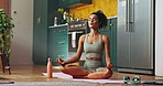 Woman, yoga and lotus on floor, home and breathing with meditation, wellness and peace in kitchen. Girl, mindfulness and exercise mat for mental health, chakra and balance in morning at apartment