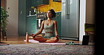 Woman, calm and lotus in home for yoga, wellness or meditation for spiritual healing at laptop. Girl, peace or position in living room for pilates, zen or posture to align chakra with online tutorial