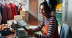 Woman, fashion designer and phone in studio with texting, contact and happy for deal with material at small business. Person, happy and app for networking with supplier, order or fabric in workshop