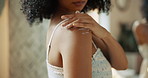 Body skincare, lotion and hands of woman with cosmetics, glow and hydration product. Smooth texture, wellness and shoulder of person in house bathroom with touch, cream beauty and grooming routine