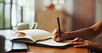 Writing, notebook and hands with pen for notes, diary entry and creative ideas on desk. Thinking, book and closeup of person for planning, schedule and agenda or to do list, calendar and journal