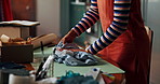 Small business, hands and packing clothes for online order with retail fashion supplier and product distribution. Ecommerce store, person and package for courier delivery, shipping and supply chain
