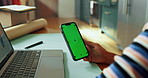 Mobile, green screen or hand at laptop for small business, connectivity or mockup space. Entrepreneur, person or tech at desk for startup management, online review or web update with tracking markers