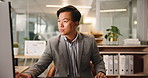 Corporate, typing and Asian man with computer, office and sales manager with notes for project and review. Reading, employee and person with tech for financial report, face and happy in business