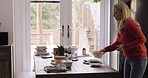 Dancing, home and woman cleaning the table with music in the dining room after dinner party. Dance, dishes and lady having fun while picking up tableware to clean the house after meal, lunch or event