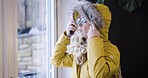 Woman, prepare and leave house with bag for shopping trip in the city. Mature woman getting ready and wearing winter coat for journey in cold town for consumer shop to buy or purchase items.