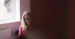Woman, book and reading at home for rest, relaxation and knowledge. Mature woman resting at home with novel for stress relief and peace in her house. Study, education and woman learning with book