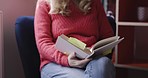 Woman, knowledge and reading book with notes at home to relax, learn and read story on cozy chair while a smile and happiness. Female, freedom and books for novel or literature study for mindfulness