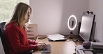 Business woman, typing and influencer doing work, planning and browse online for startup company, focus and concentration. Freelancer, technology and chair with light ring, remote work and at home.
