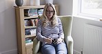 Sadness, tea and lonely woman on sofa, drinking, thoughtful and looking out window. Thinking, depression and middle aged lady sitting on couch with cup of coffee, drink hot beverage and contemplating