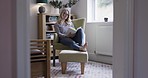 Woman reading book in home library, relax on armchair and lounge in quiet New York apartment. Fantasy novel, happy girl learning with storytelling books on sofa and comfortable weekend lifestyle