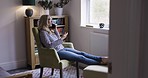 Phone call, talking and happy with a mature woman having a conversation while sitting in a house to relax. Smartphone, communication and smile with a female in glasses chatting while sitting at home