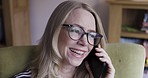 Phone call, communication and face of a woman with a smile while talking on a mobile in a house. Conversation, connection and mature person with a smartphone and peace for speaking while in a home