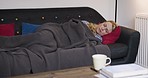 Sleep, tired and woman on the living room sofa of her house. Relax, peace and young, peaceful and dreaming person with a blanket for rest, sleeping and calm on the couch of lounge in a home at night