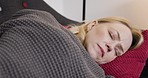 Peace, tired and woman sleeping for wellness on house sofa dreaming, calm and comfortable. Relax, sleep and nap of lady resting on home couch with peaceful and stress free dream face.

