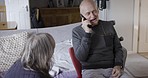 Phone call, physiotherapy and rehabilitation with a senior man talking on his smartphone while in his retirement home. Healthcare, conversation and mobile with an elderly male in a house for recovery