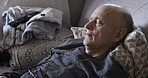 Old man sleeping on sofa, living room and relax, dreaming and nap after watching tv in peace, quiet and calm at home. Tired, sleepy and elderly senior pensioner rest on couch for retirement in lounge