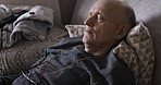 Senior man, tired and sleeping on a couch in the living room at a nursing home for rehabilitation for recovery, energy and health. Sleep, relax and calm elderly male on sofa for peace and rest