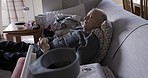 Retirement, sleeping and senior man on sofa to relax, tired and retired with peace, on couch and in living room. Rehabilitation, elderly man and rest in home, being peaceful, napping and in lounge.