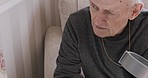 Elderly man, thinking and face or relax on sofa in living room for rehabilitation, rest and calm retirement. Peace, senior person and peaceful vision, relaxing on couch alone with crutch in apartment